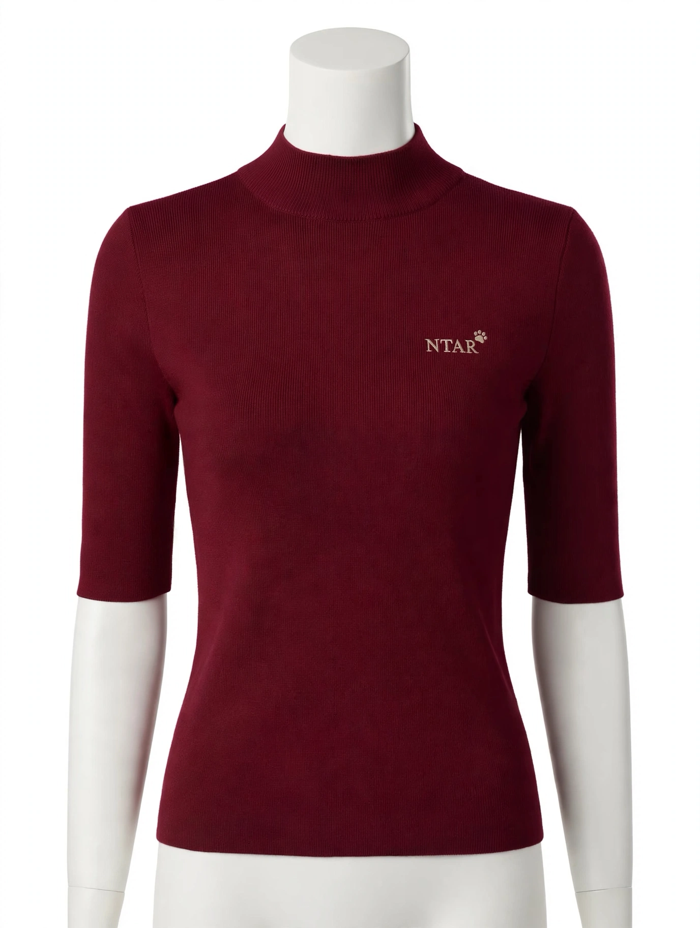 Wine-red mock-neck half-sleeve knit top on a mannequin, with a small embroidered NTAR paw logo on the chest